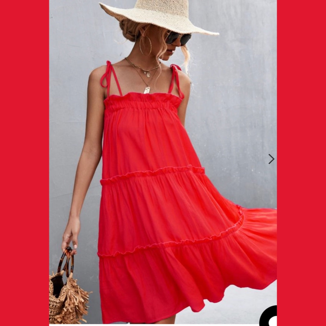Super cute beautiful red ruffly tiered sun dress with shoulder tie straps. Nice and roomy, lightweight flowy dress that is perfect for hot sunny days.  Flexible fit dress! Nice cotton blend fabric. This dress runs roomy could down size! 